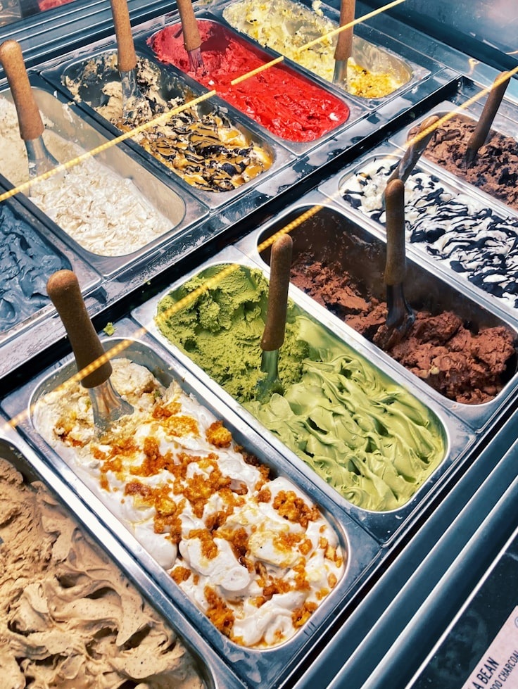 Different gelato flavors in cooling case